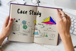Hands hold a "Case Study" notebook with diagrams for data-driven community analysis.
